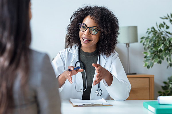 a doctor engaging in conversation with a patient in a clinic setting offering medical advice for optimal health and wellness strategies including eight key tips